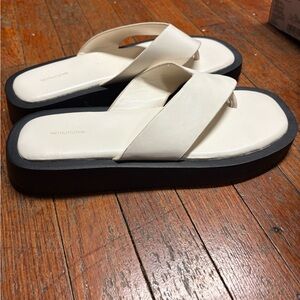 Raid Cream and Black Sandals
